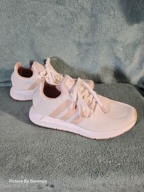 Adidas Swift Run 1.0. This specific colorway appears to be "White Vapour Pink"